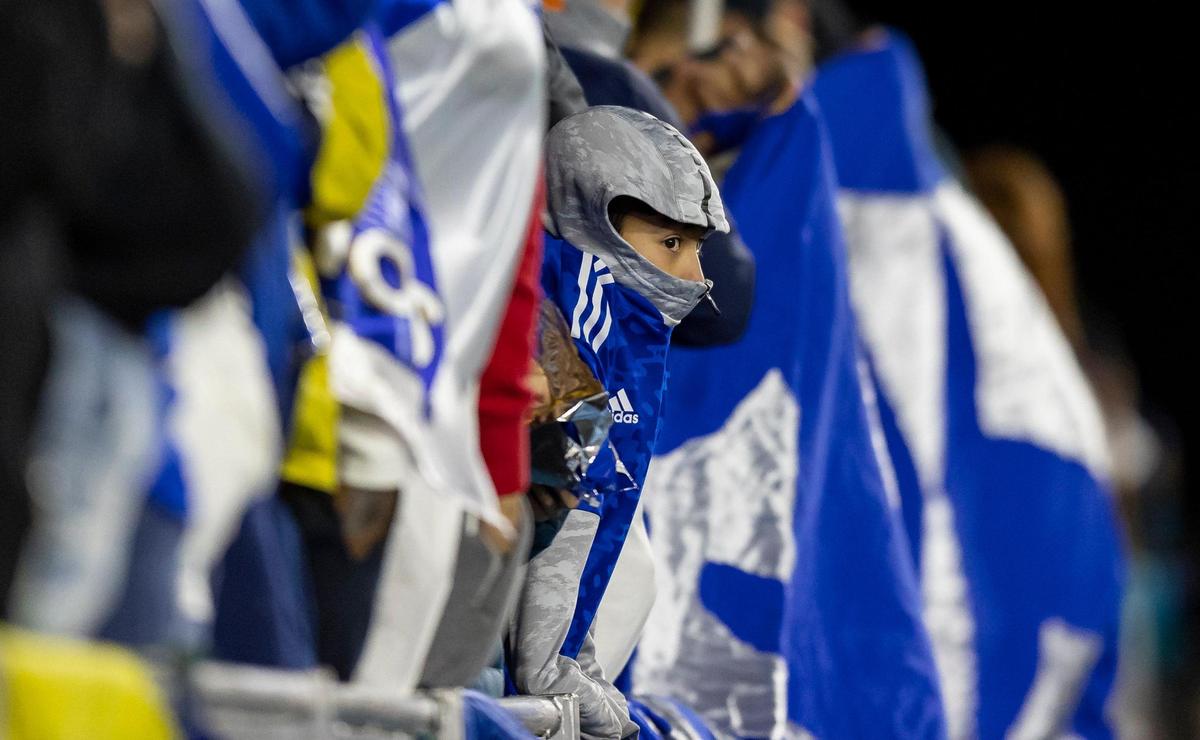 A Millonarios FC fan watches his team during the second half of a friendly soccer match against River Plate at DRV PNK Stadium on Saturday, Jan. 14, 2023 in Fort Lauderdale, Fla.