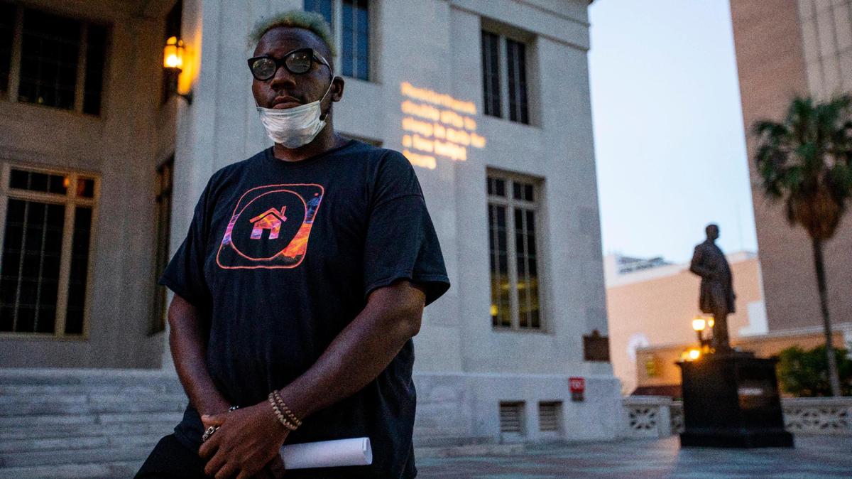Niklaus Salvator, 28, spoke during a demonstration hosted by the Florida Housing Justice Alliance to protest the premature end of the eviction moratorium in front of the Miami-Dade County Courthouse in Downtown Miami, Florida on Tuesday, June 30, 2020.