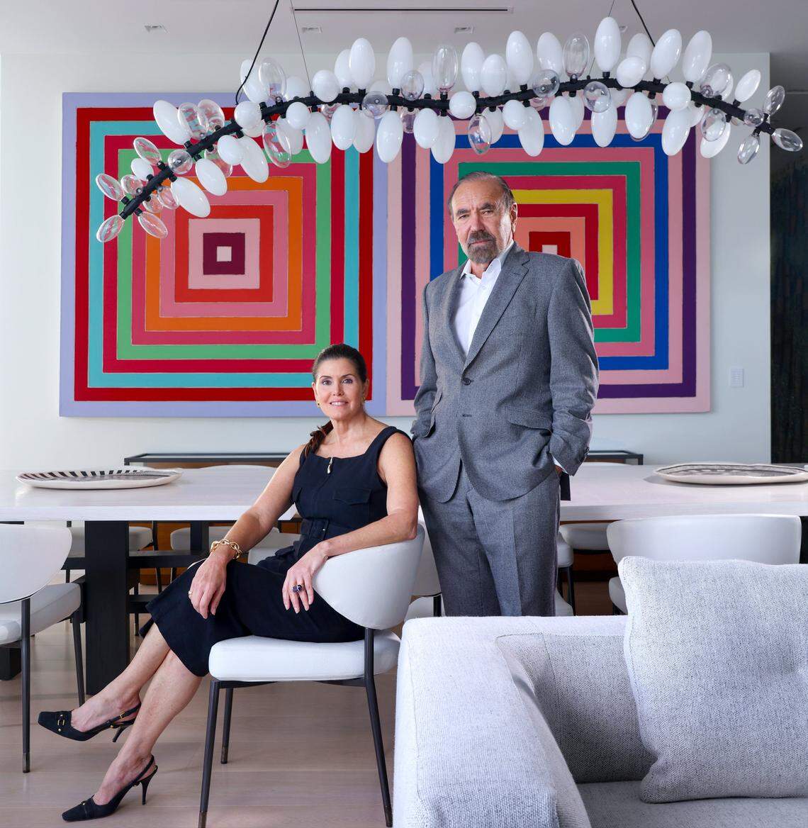 Art collectors Darlene, left, and Jorge Perez, right, are photographed among two of their pieces: an artwork by Frank Stella and a Chandelier by Lindsey Adelman, on Wednesday, November 13, 2025, in Miami, Florida.