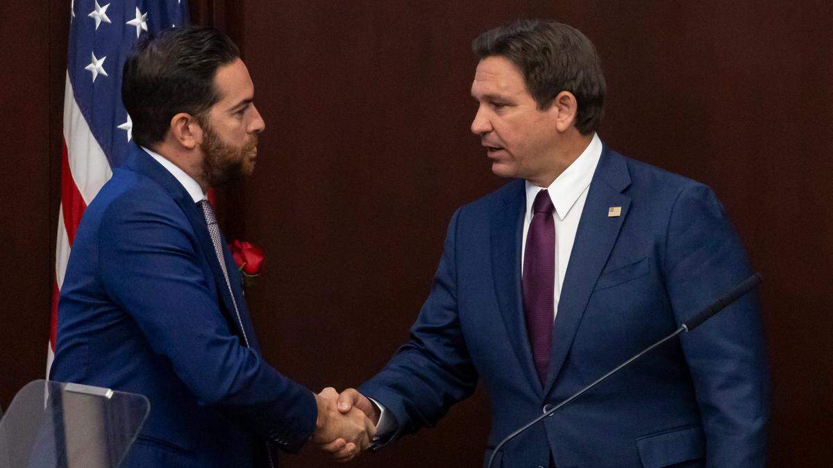 Florida Governor Ron DeSantis shakes hands with Florida House Speaker Daniel Perez, R-Miami, after delivering his State of the State during the first day of the legislative session at the Florida State Capitol on Tuesday, March 4, 2025, in Tallahassee, Fla.