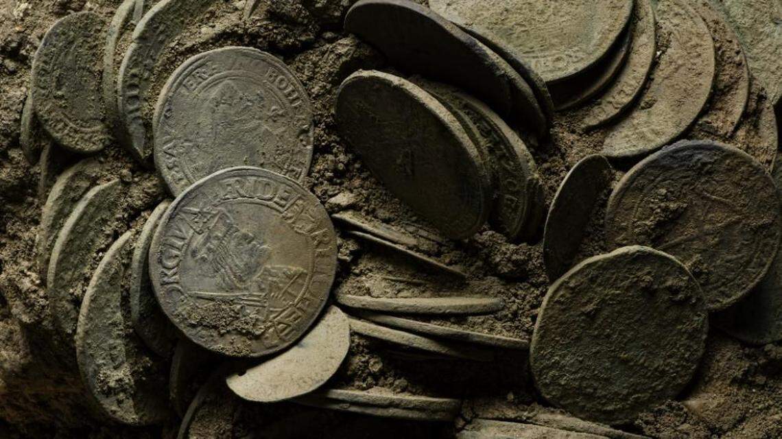 A close-up photo of the buried coins.