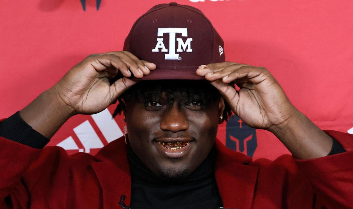 Monsignor Edward Pace defensive end Shemar Stewart reacts after choosing to sign with Texas A&M University football during National Signing Day at Monsignor Edward Pace High School in Miami Gardens, Florida, on Wednesday, February 2, 2022.