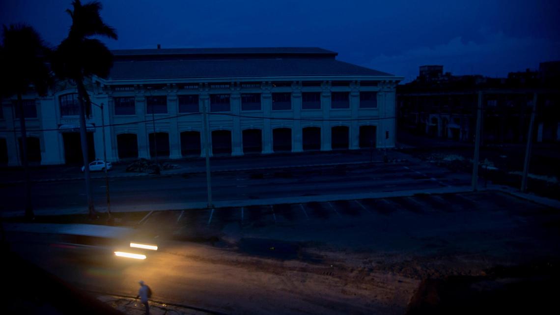 A vehicle’s headlights illuminate the street during a blackout triggered by Hurricane Ian in Havana, Cuba, early morning Wednesday, Sept. 28, 2022. Hurricane Ian knocked out electricity to the entire island when it hit the island’s western tip as a major storm.