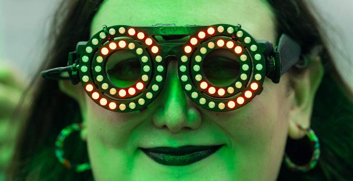 An attendee wears colorful glasses on the Worldwide Stage during Ultra Music Festival’s 25th anniversary at Bayfront Park on Saturday, March 29, 2025, in downtown Miami, Fla.