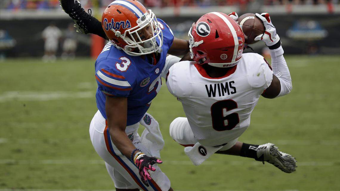 Florida cornerback Marco Wilson (3) tries to stop Georgia wide receiver Javon Wims on Oct. 28, 2017, in Jacksonville.