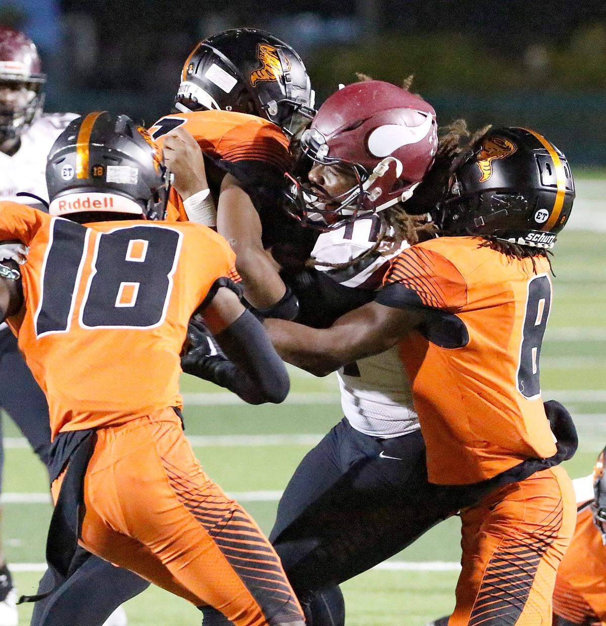 Booker T. Washington Tornadoes defenders tackle Norland Vikings quarterback Ennio Yapoor during football game on Thursday, November 17, 2022 at Traz Powell Stadium in Miami. Andrew Uloza / for Miami Herald