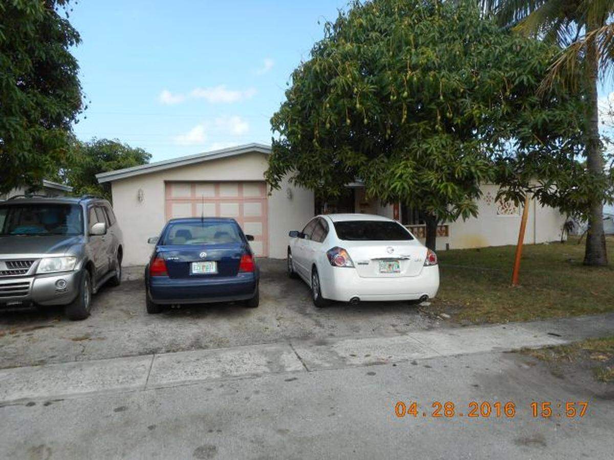 State records say Nikency Alexis ran Unity Tax and Financial Services out of this Lauderdale Lakes home, owned by his parents. The IRS hit Unity with a search warrant 13 days before this picture.