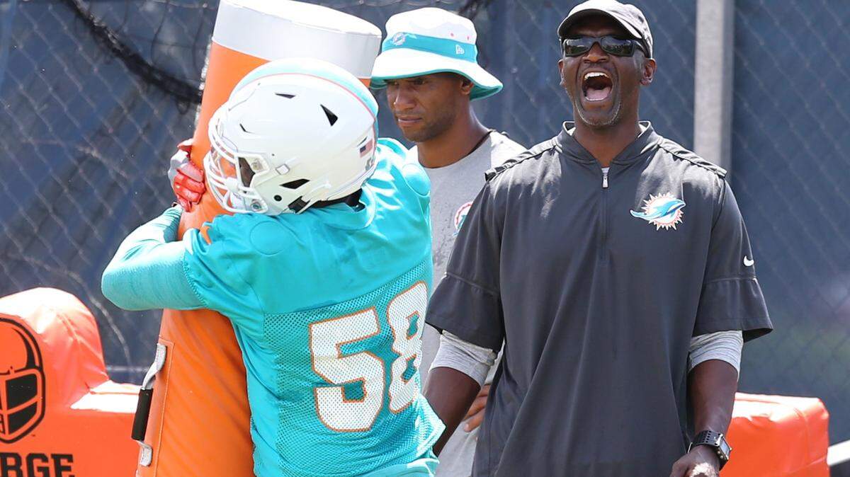 Linebacker Mike McCray hits a blocking sled during OTAs back in June. McCray announced his retirement Tuesday.