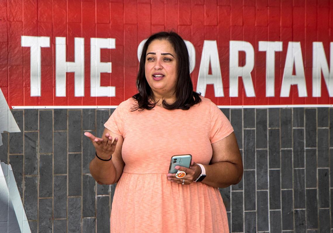 Jennifer Desa, a journalism and social studies teacher at Miami Southridge High, says she’s concerned that Florida’s new education laws can embolden parents, which can potentially impact the learning environment. She posed in front of her school on Friday, Aug.12, 2022.