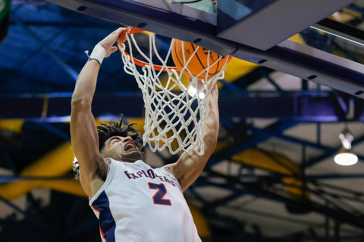 Columbus guard Cayden Boozer (2) dunks the basketball during the first half of the basketball regional final against Deerfield Beach at the Ocean Bank Arena at Florida International University in Miami, Florida, Friday, February 24, 2023.