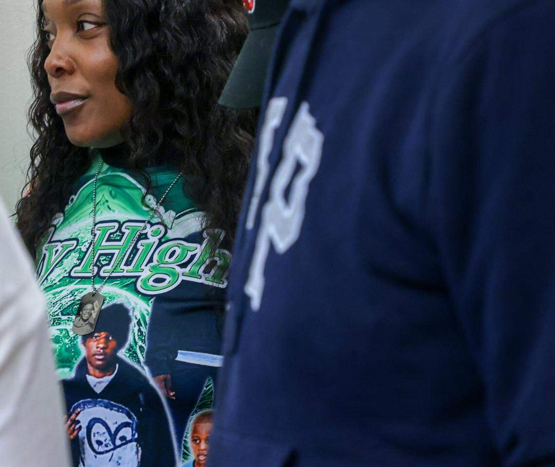 Nathalie Jean, left, the mother of Northwestern student-athlete Yahkeim Lollar, who was stabbed to death in December 2024, huddles with the prosecutor,  attorney, and family members outside the courtroom after the teen's loved ones decided they want to exercise their rights to a speedy trial on Thursday, Jan. 22, 2026, in Courtroom 2-8 inside Richard E. Gerstein Justice Building in Miami, Florida. Yahkeim's on-again, off-again girlfriend Jahara Malik is charged with manslaughter.