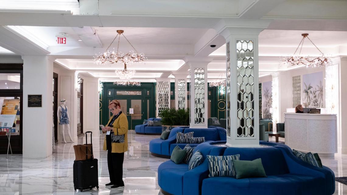 A guest stands in the remade lower lobby of the historic Biltmore Hotel. Coral Gables officials halted renovations at the city-owned hotel’s ground floor that stripped off or covered up historic features with white paint, marble flooring and mirrors after discovering the work was being done without permits.
