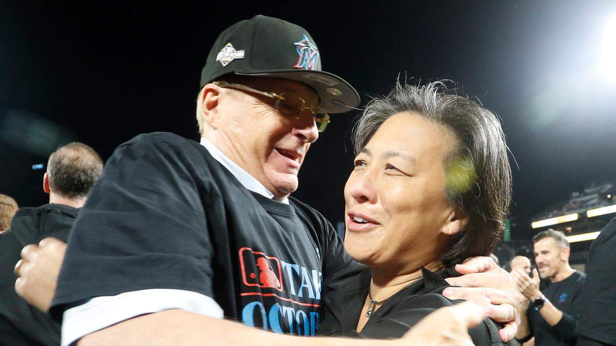 Sep 30, 2023; Pittsburgh, Pennsylvania, USA; Miami Marlins owner Bruce Sherman (left) and general manager Kim Ng (right) embrace on the field after the Marlins defeated the Pittsburgh Pirates at PNC Park to secure a berth in the 2023 MLB playoffs.