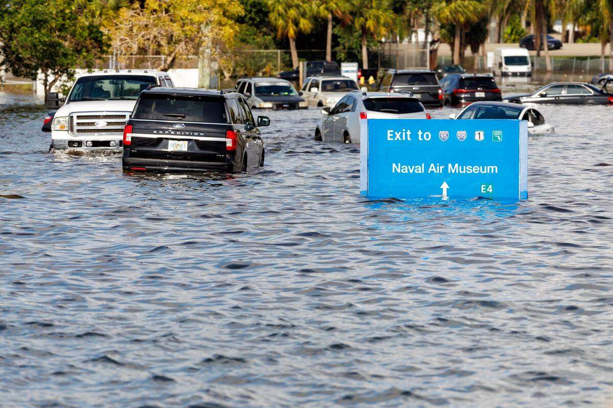 Vehicles submerged in flooded street caused by heavy rain on West Perimeter Road around the Fort Lauderdale Hollywood International Airport after the infamous “rain bomb” in April 2023.