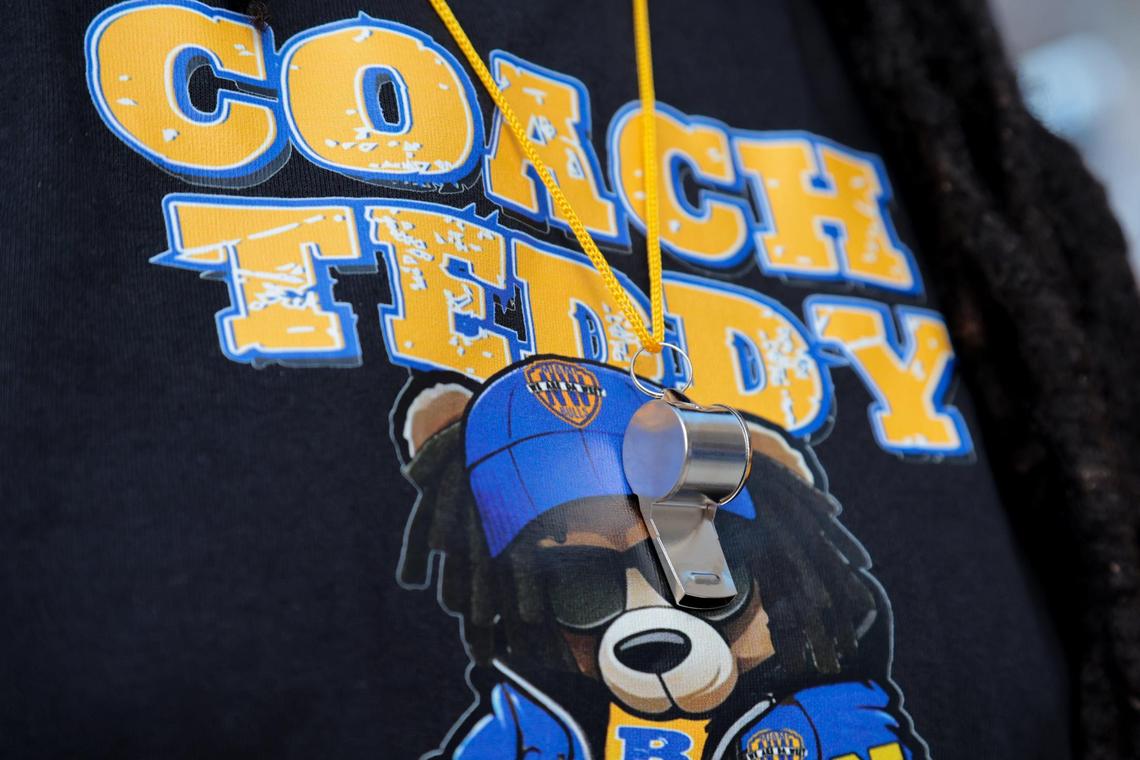 Nay Akins wears a t-shirt and a whistle around her neck to show support for the reinstatement of suspended Miami Northwestern football coach and former Miami Dolphins quarterback Teddy Bridgewater outside of Miami Northwestern Senior High School in Miami, Florida, Thursday, July 24, 2025.