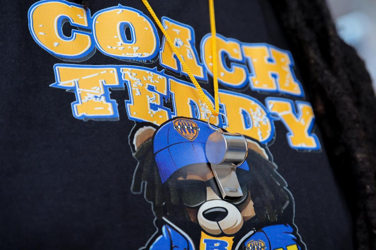 Nay Akins wears a t-shirt and a whistle around her neck to show support for the reinstatement of suspended Miami Northwestern football coach and former Miami Dolphins quarterback Teddy Bridgewater outside of Miami Northwestern Senior High School in Miami, Florida, Thursday, July 24, 2025.