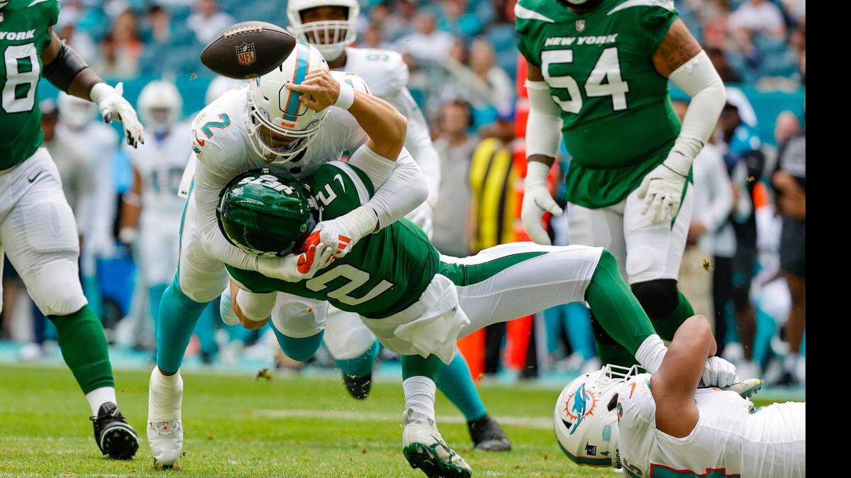 Miami Dolphins linebacker Bradley Chubb (2) sacks New York Jets quarterback Zach Wilson (2) in the first quarter at Hard Rock Stadium in Miami Gardens, Florida on Sunday, December 17, 2023.