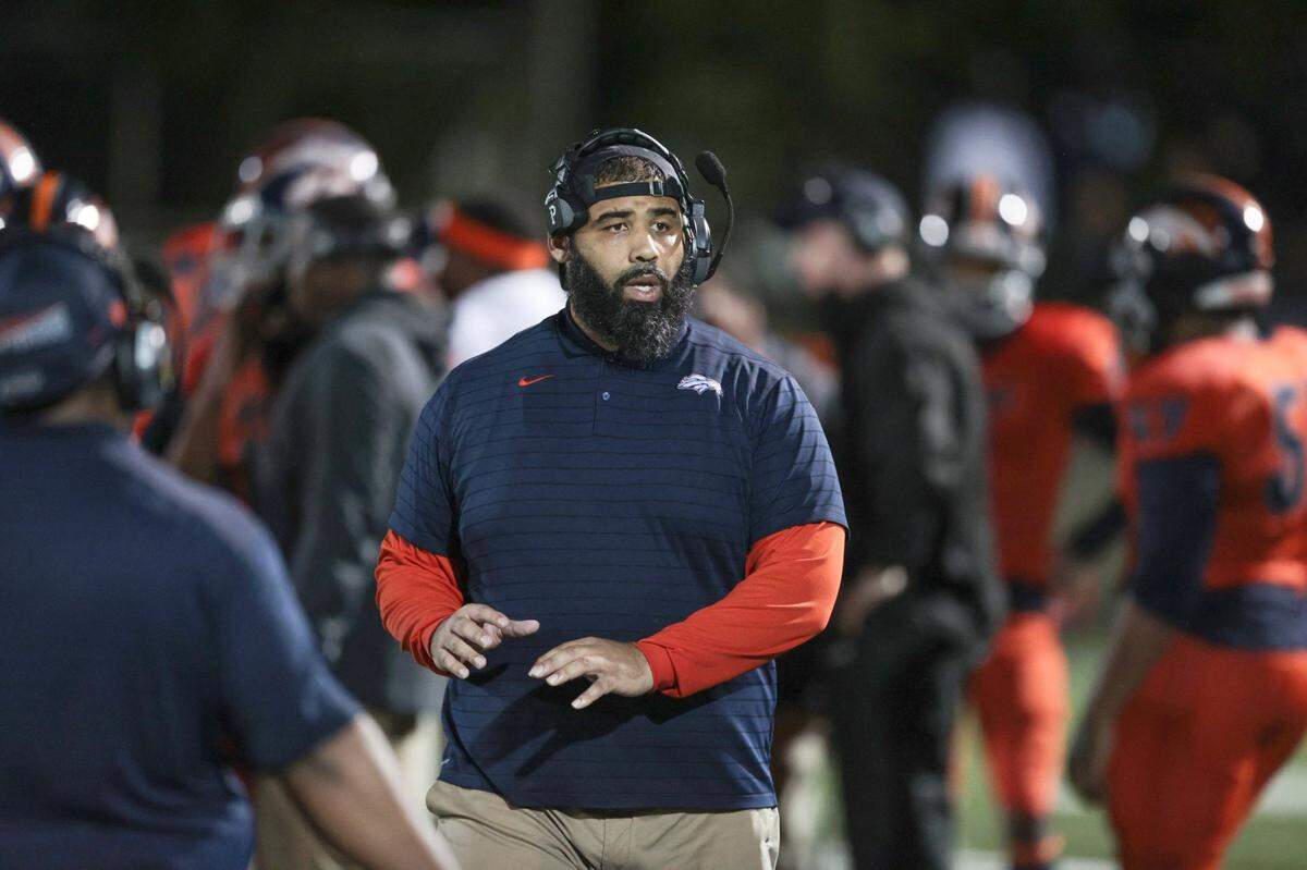 Homestead Broncos coach Philip Simpson on the sidelines during game against Dillard High at Orange Bowl Field at Harris Field Park in Homestead on Friday, November 19, 2021