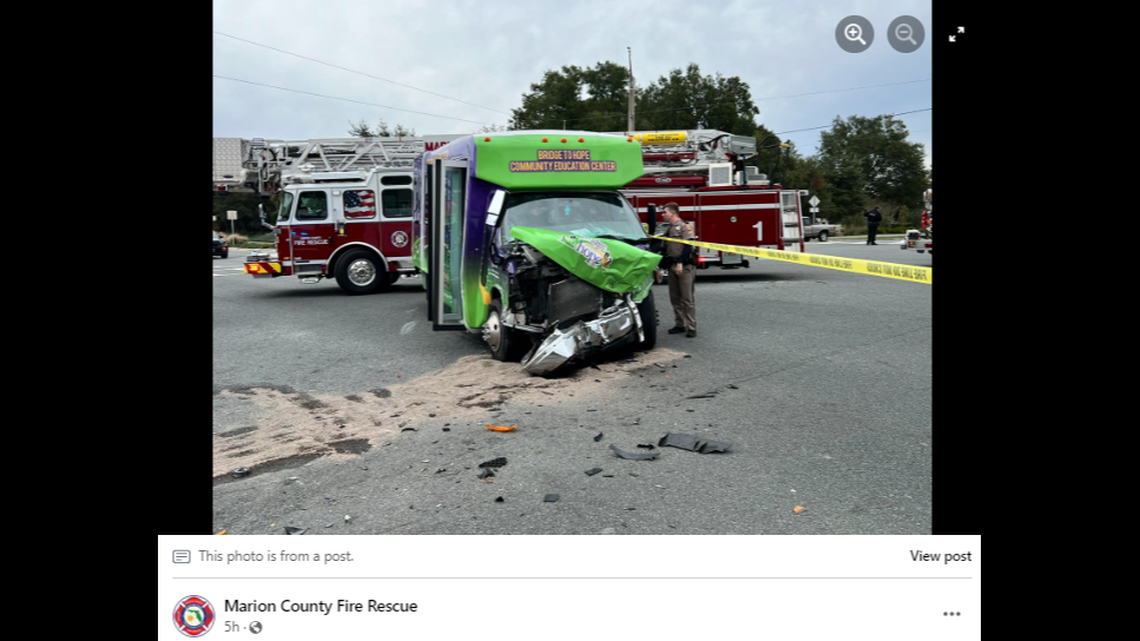 A small bus carrying students with special needs collided with the emergency vehicle in an intersection.