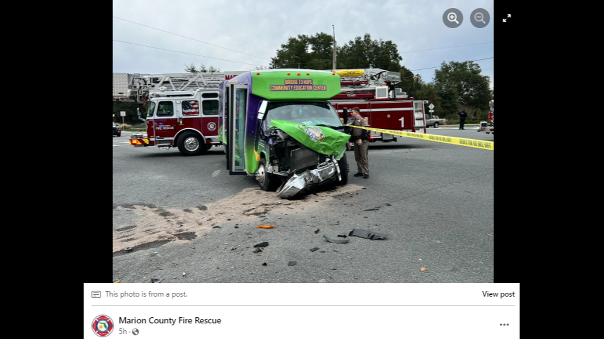 A small bus carrying students with special needs collided with the emergency vehicle in an intersection.