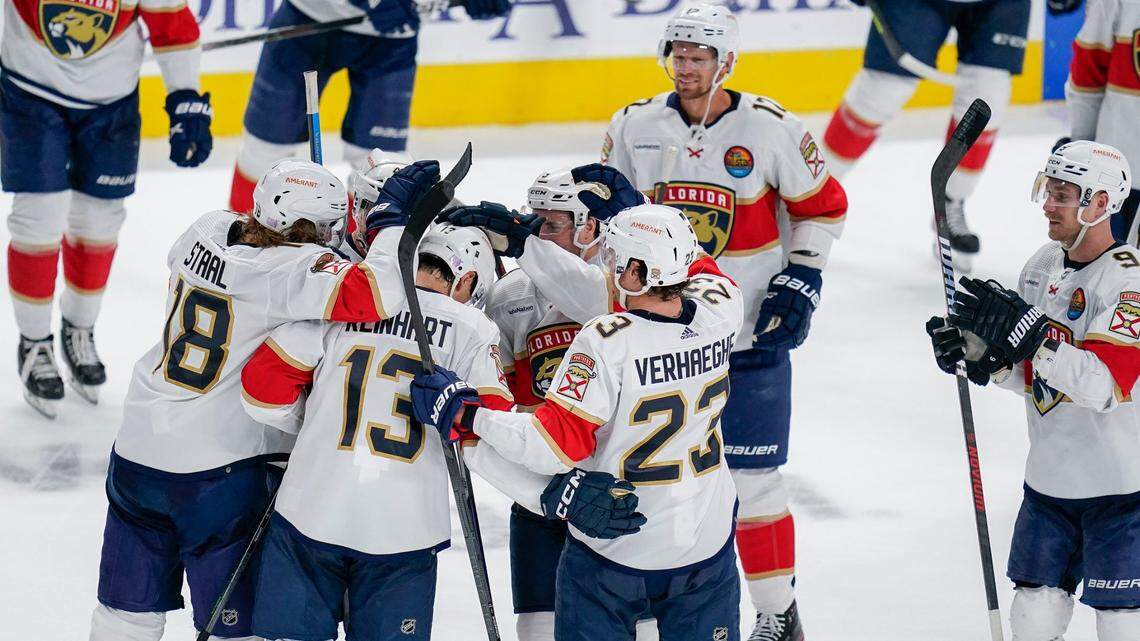Florida Panthers center Sam Reinhart (13) celebrates with teammates after scoring the winning goal against the San Jose Sharks during the shootout of an NHL hockey game in San Jose, Calif., Thursday, Nov. 3, 2022.