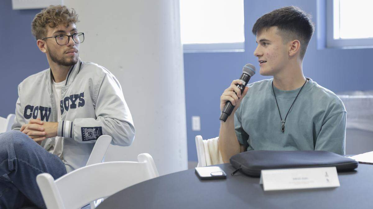 Ian Rodríguez Galán, left, listens as Elevate Miami Impact Fellow Diego Guiu talks about reviewing the Elevate Miami Award nominees.