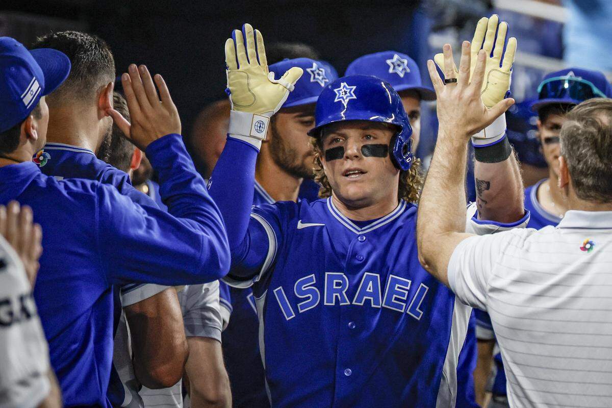 Israel outfielder Harrison Bader (2) celebrates in the dugout after a homer on a fly ball to center field in the 9th inning of the World Baseball Classic against Israel at loanDepot park in Miami, Florida, on Saturday, March 7, 2026. on a fly ball to center field.