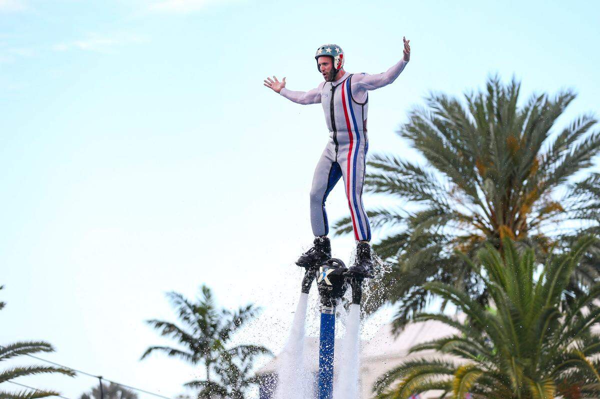 Troy Stowe of The Nerveless Nocks Jetpack Flying Water Circus performs during the opening day of the Miami-Dade County Youth Fair at the Miami-Dade Fair & Expo Center in Miami, Florida, on Thursday, March 17, 2022.