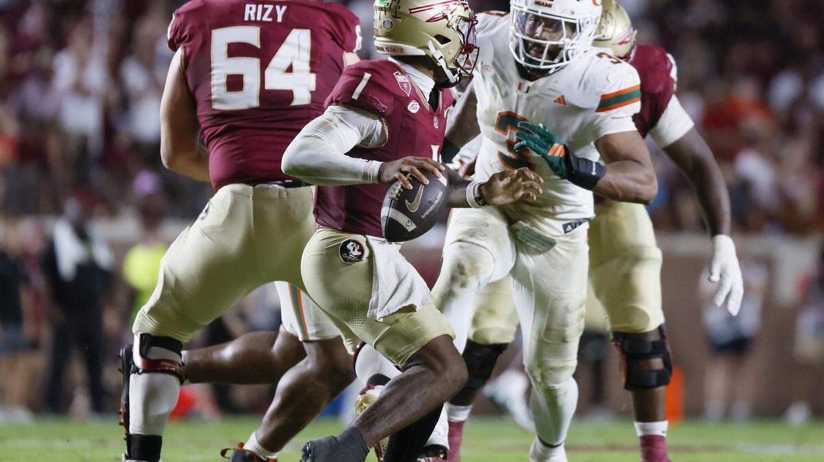 Miami Hurricanes defensive lineman Akheem Mesidor (3) breaks through FSU’s offensive line to sack Florida State Seminoles quarterback Tommy Castellanos.