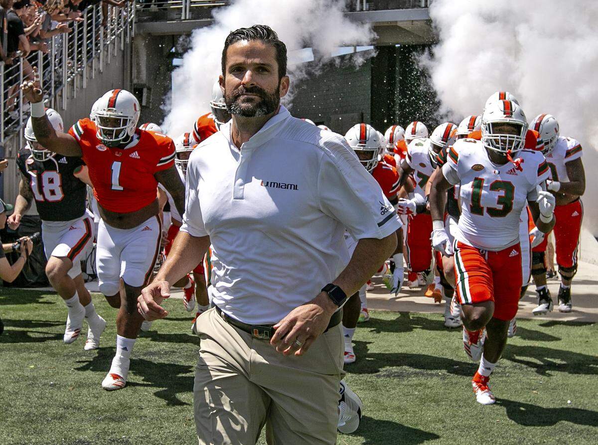 Miami Hurricanes head coach Manny Diaz leads the team onto the field at the start of the Miami Hurricanes spring game at Camping World Stadium in Orlando on Saturday, April 20, 2019.