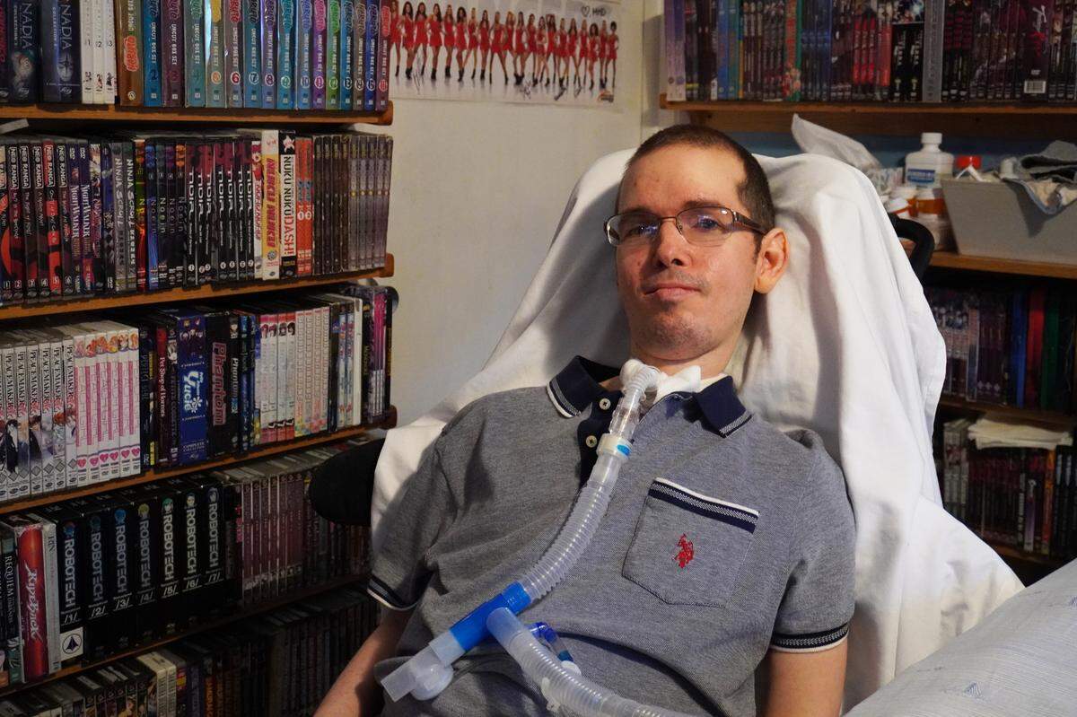 David Leal, 43, sits next to his anime and manga collection. He credits Japanese culture for influencing his graphic novel series.