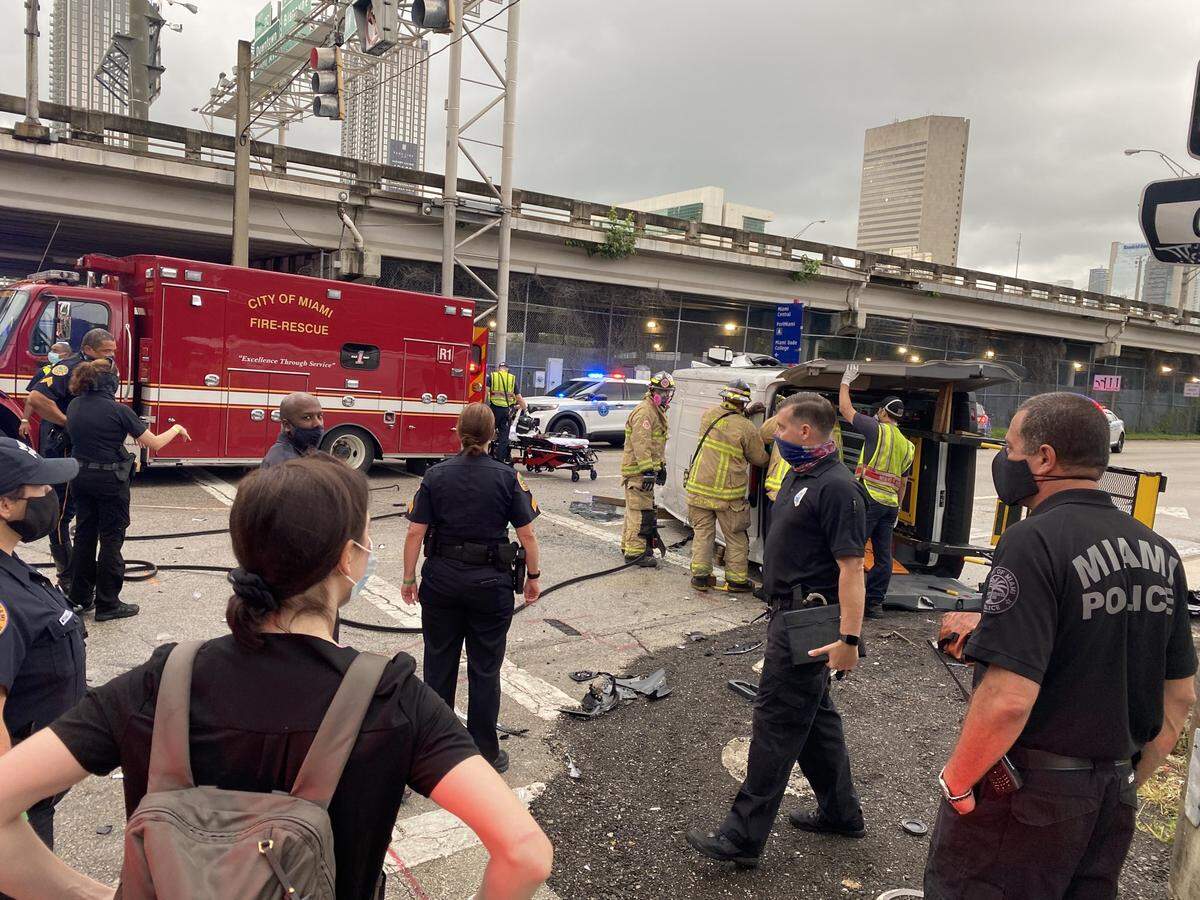 Fire rescue works to save a woman in a wheelchair who is trapped inside a crashed car in Miami, police said.