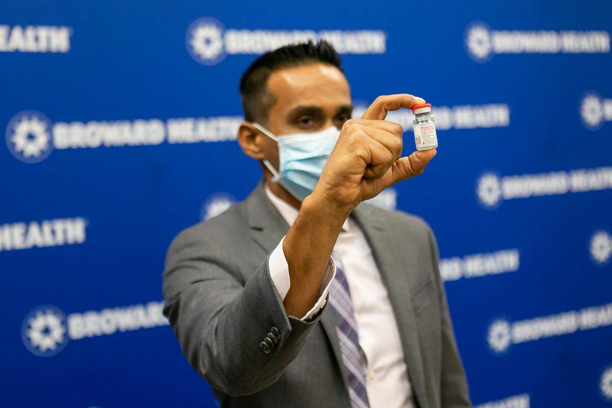 Dave Lacknauth, Pharm. D., Director of Pharmacy Services, with Broward Health Medical Center holds the Moderna COVID-19 vaccine at Broward Health Imperial Point in Fort Lauderdale, Florida on Wednesday, December 23, 2020.