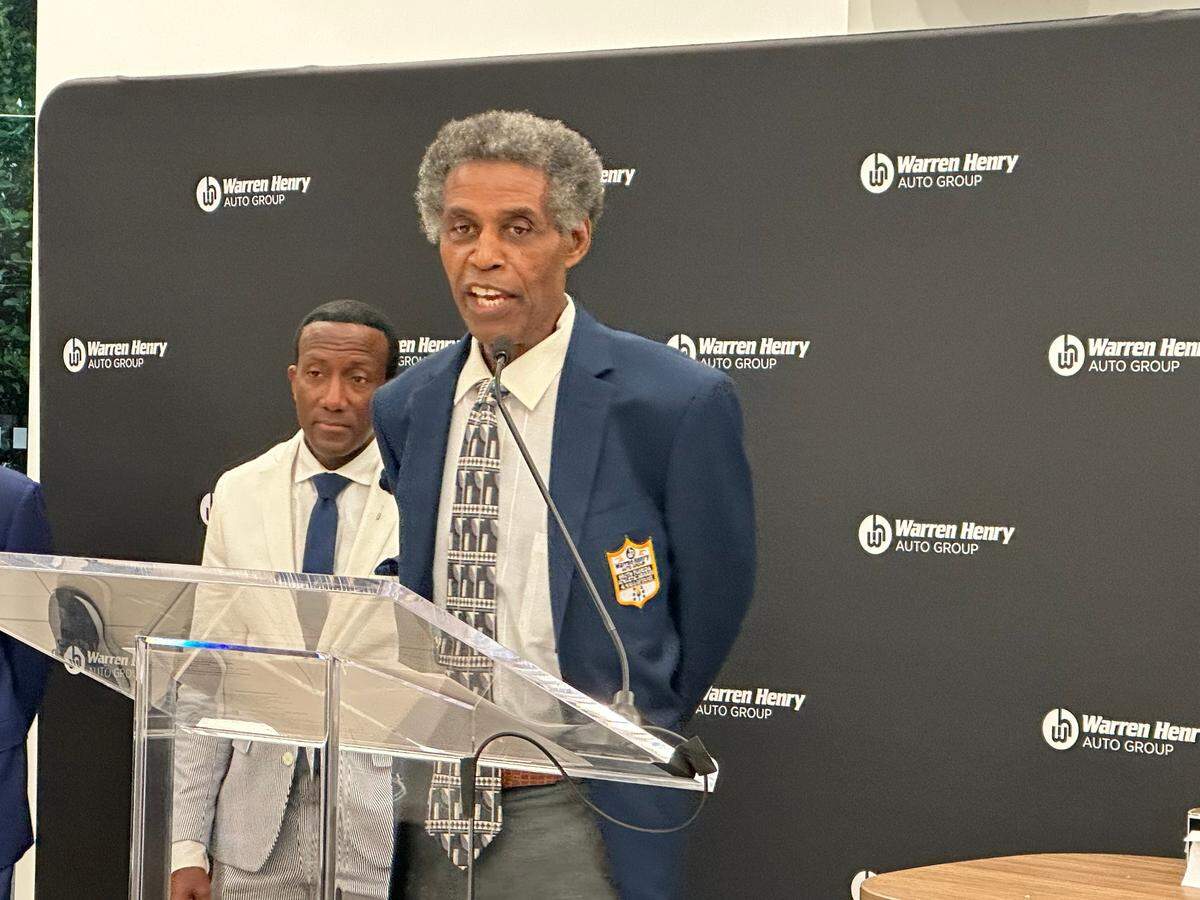 Legendary former Miami Carol City football coach Walt Frazier is honored with the Warren Henry Auto Hall of Fame Coaches award during a ceremony on Wednesday night at the Warren Henry Auto dealership in North Miami Beach.