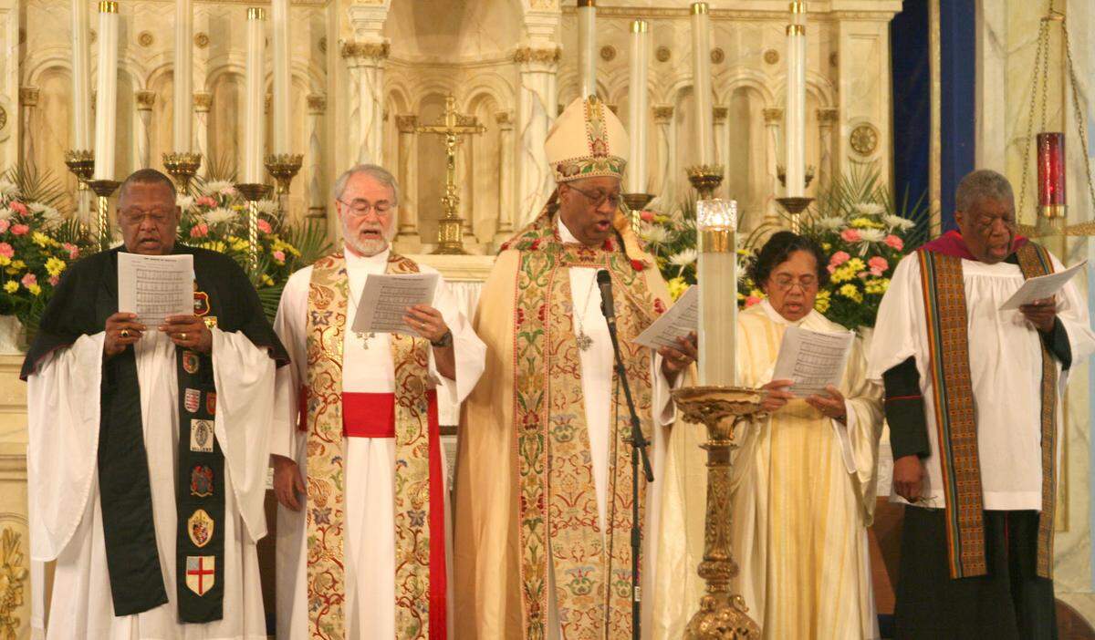 In this Feb. 10, 2007, file photo at the Historic Saint Agnes Episcopal Church in Overtown, from left to right: the Rev. Richard L. Marquess-Barry; Arch Deacon Bryan Hobbs; the Rev. James H. Ottley, assistant bishop of the Episcopal Diocese of Southeast Florida; the Rev. Doris Ingraham of Saint Agnes; the Rev, Nelson W. Pinder, national president of the Union of Black Episcopalians.