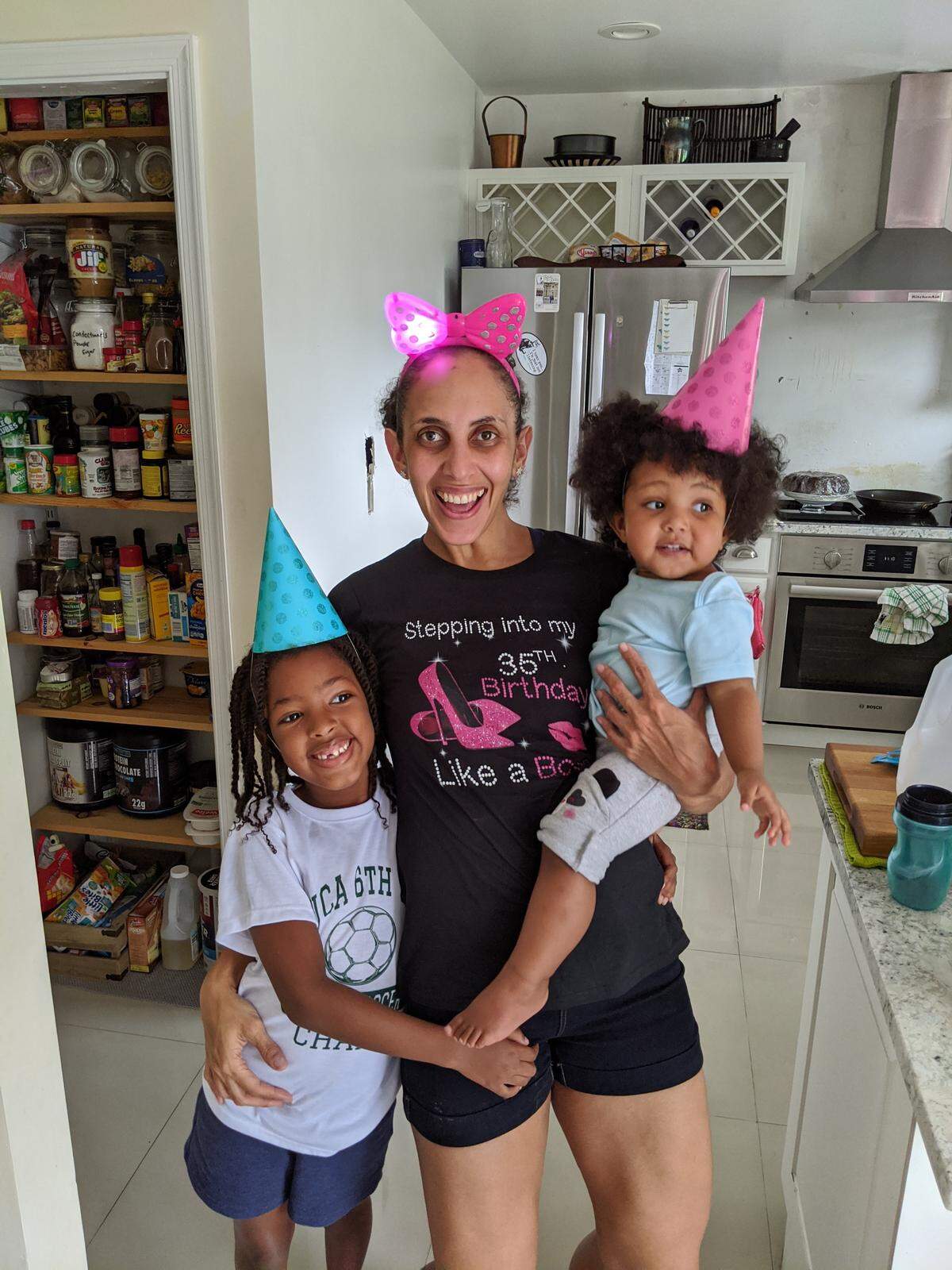 Dr. Lesley Farquharson, an overnight intensivist at the University of Miami Hospital, enjoys a moment at home with her two daughters, Amira and Leah, ages 6 and 1. Farquharson has been treating patients with COVID-19 as a physician in the intensive care unit.
