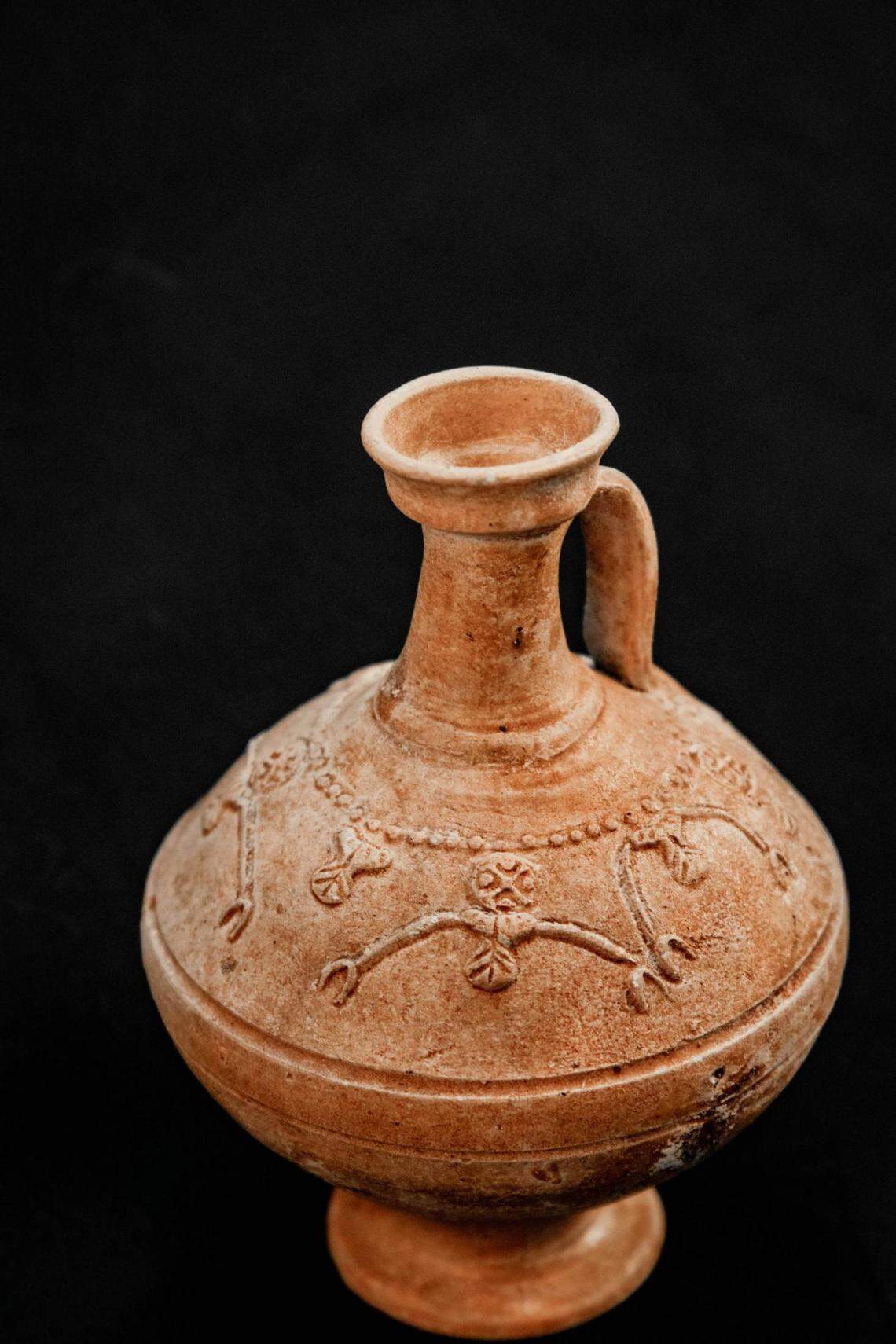 A decorated lead jug.