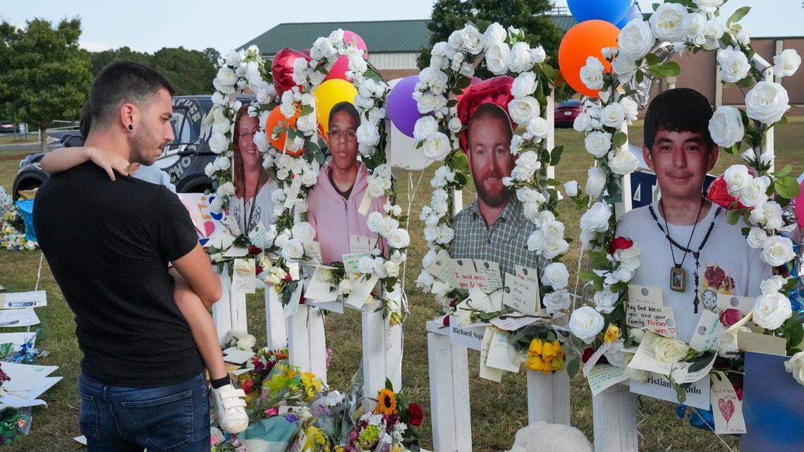 Mourners gather at Apalachee High School in Barrow County, Ga., where two teachers and two students were gunned down on Sept. 4, 2024, investigators say, by a 14-year-old student.