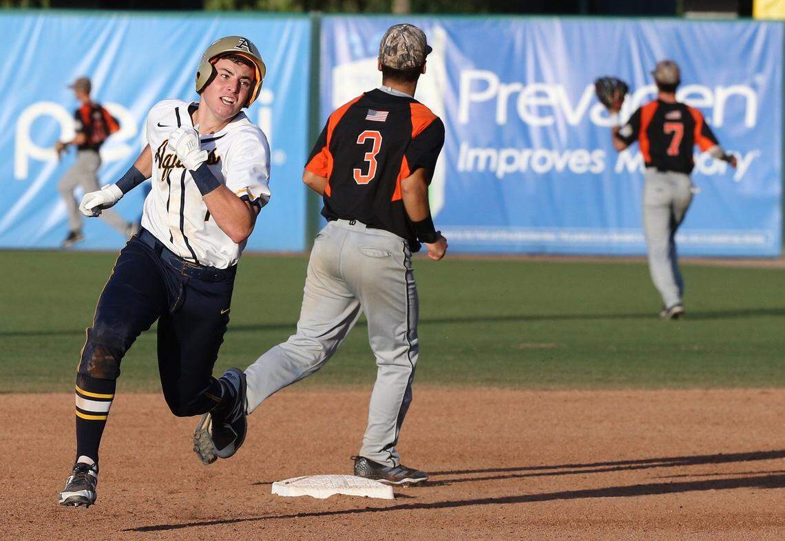 Saint Thomas Aquinas HS Caleb Roberts (7) hits a triple and drives in runs in the fifth inning as they play Sarasota HS in the Class 8A in the FHSSA Baseball State Championships in Fort Myers, Florida, June 2, 2018.