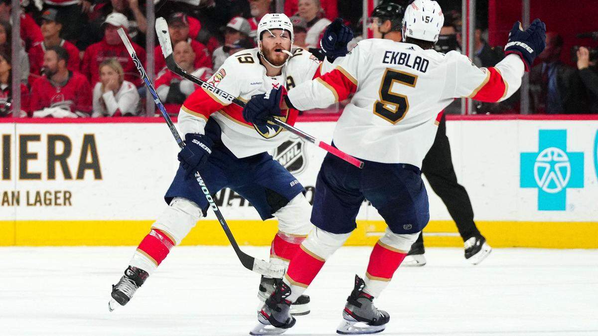 May 18, 2023; Raleigh, North Carolina, USA; Florida Panthers left wing Matthew Tkachuk (19) reacts with defenseman Aaron Ekblad (5) after scoring the game winning goal against the Carolina Hurricanes during the fourth overtime period of game one in the Eastern Conference Finals of the 2023 Stanley Cup Playoffs at PNC Arena. Mandatory Credit: James Guillory-USA TODAY Sports