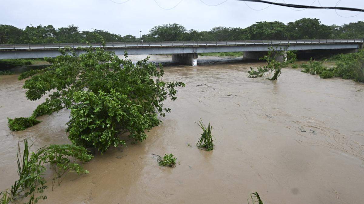 The Rio Cobre overflows its banks near St. Catherine, Jamaica, on October 28, 2025, as Hurricane Melissa tore into the island.
