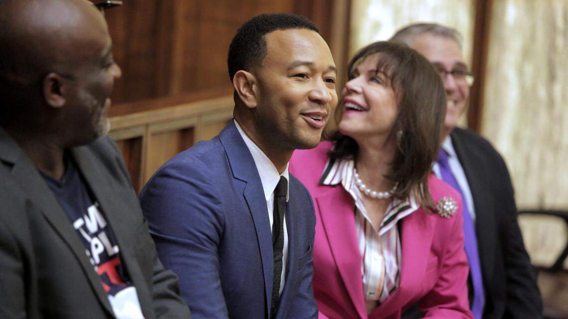 Singer John Legend, second from left, attended a special hearing in Miami-Dade on Nov. 8, 2019 to restore voting rights to former felons under Floridaâ’s Amendment 4. “I wanted to be here today because it’s a celebration,” Legend told reporters. “It’s so beautiful to see real people affected by this law change. They’re here crying, they’re so happy to vote.” Seated with Mr. Legend are (left to right), Desmond Meade, president of the Florida Rights Restoration Coalition, State Attorney Katherine Fernandez Rundle and Public defender, Carlos Martinez.