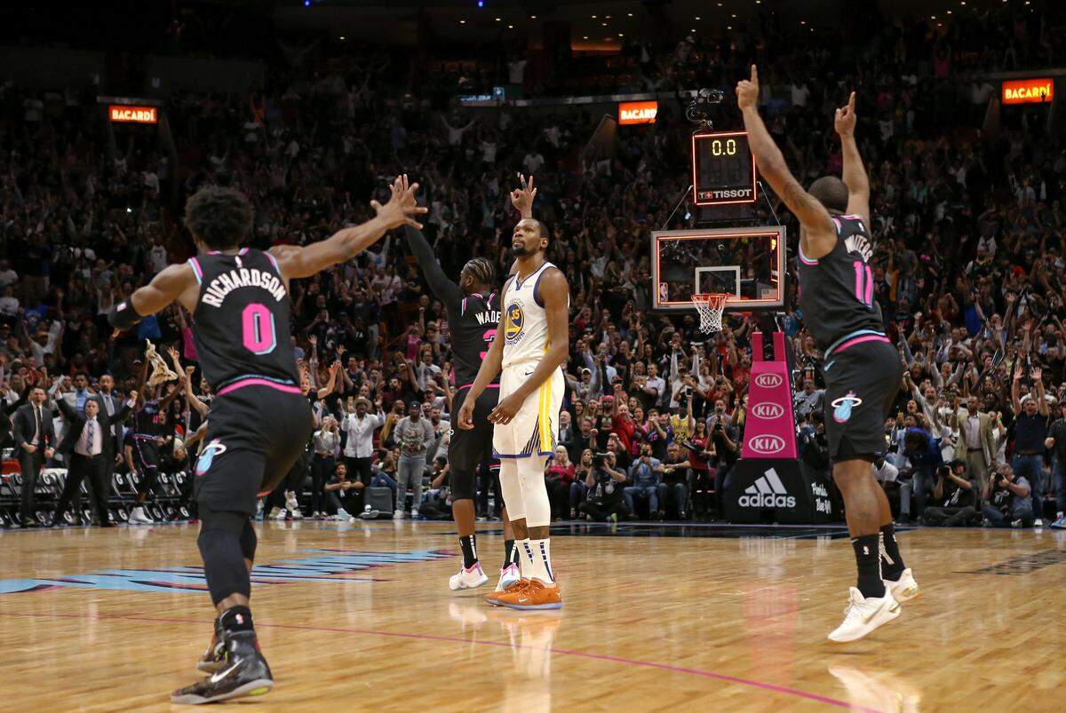 Miami Heat guard Dwyane Wade (3) reacts after hitting a three pointer buzzer beater in the fourth quarter of an NBA basketball game against the Golden State Warrios at AmericanAirlines Arena on Wednesday, February 27, 2019 in Miami. Heat won 126-125.