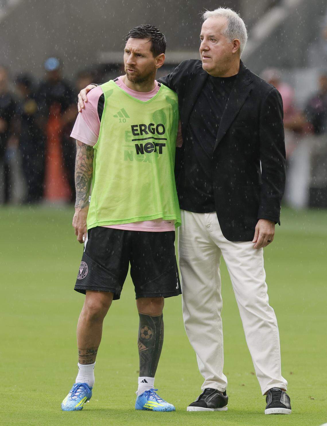Inter Miami CF forward Lionel Messi (10) and Managing Owner and CEO of Inter Miami CF Jorge Mas embrace as they arrive on the field at Nu Stadium on Thursday, April 2, 2026.