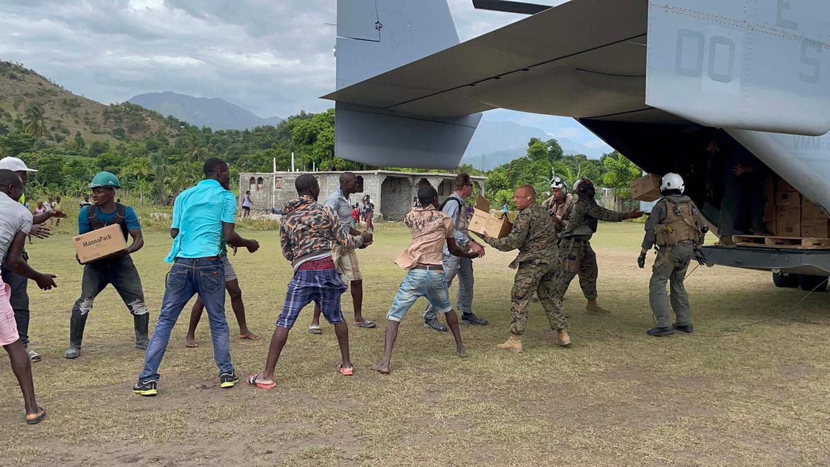 U.S. military aircraft drops off aid on Friday, Aug. 21, 2021, to Les Anglais, a remote community on Haiti’s southern peninsula that was devastated by the Aug. 14 earthquake.