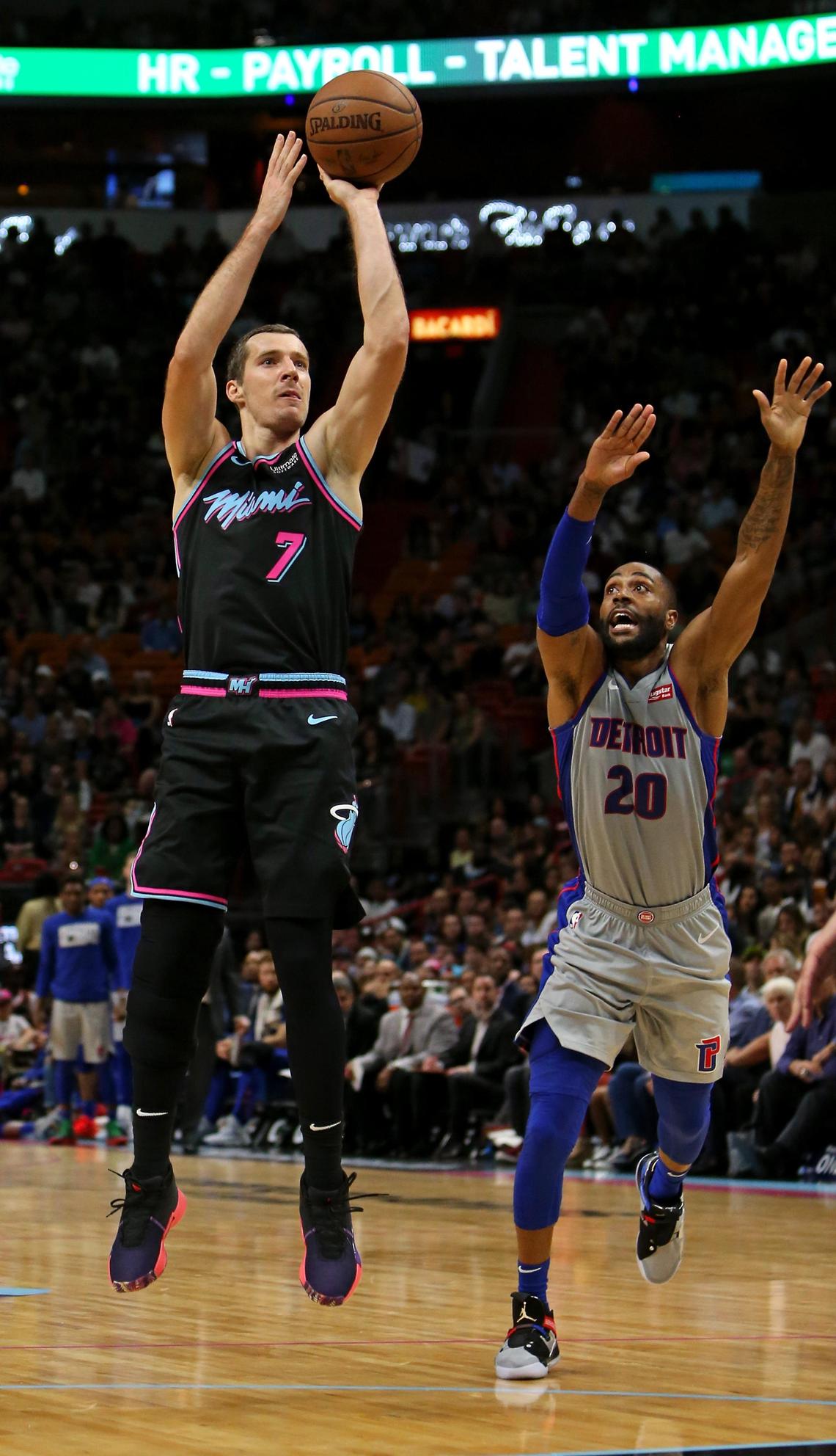 Miami Heat guard Goran Dragic (7) shoots against Detroit Pistons guard Wayne Ellington (20) in the second quarter of an NBA basketball game at AmericanAirlines Arena on Saturday, February 23, 2019 in Miami.