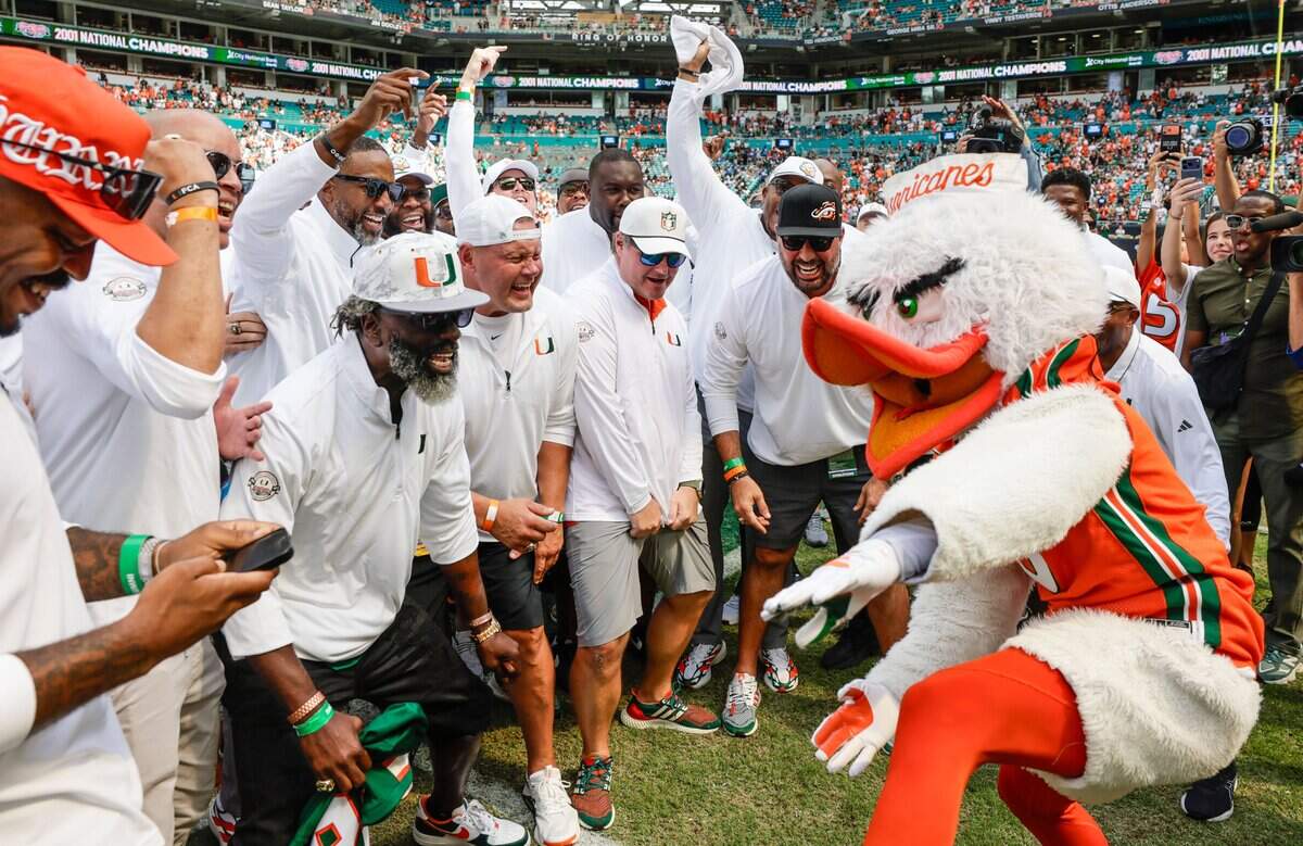 Miami Hurricanes team members of the 2001 National Championship team dance on the field during a half time celebration at the UM game against the Pittsburgh Panthers at Hard Rock Stadium in Miami Gardens, Florida, on Saturday, October 24, 2026.