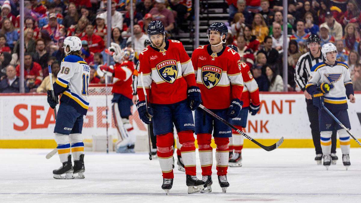 Florida Panthers players react to a St. Louis Blues point during the second period of an NHL game at Amerant Bank Arena in Sunrise, Florida, on Thursday, December 21, 2023.