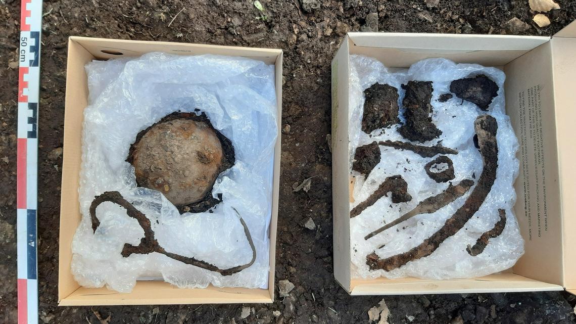 Archaeologists found a burial site with a shield, knives, and horse equipment in a garden in the Holmen neighborhood of Oslo, photos show.