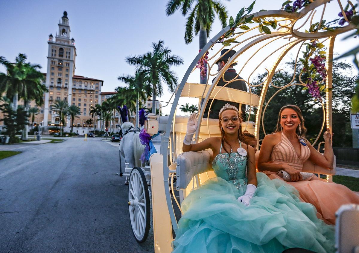 Angelina Uzdavines arrives with her mother, Marilyn Uzdavines, at the Make-A-Wish Glitter Gala at the Biltmore Hotel in Coral Gables Friday.